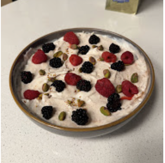 Cottage cheese bowl with mixed berries and pistachios