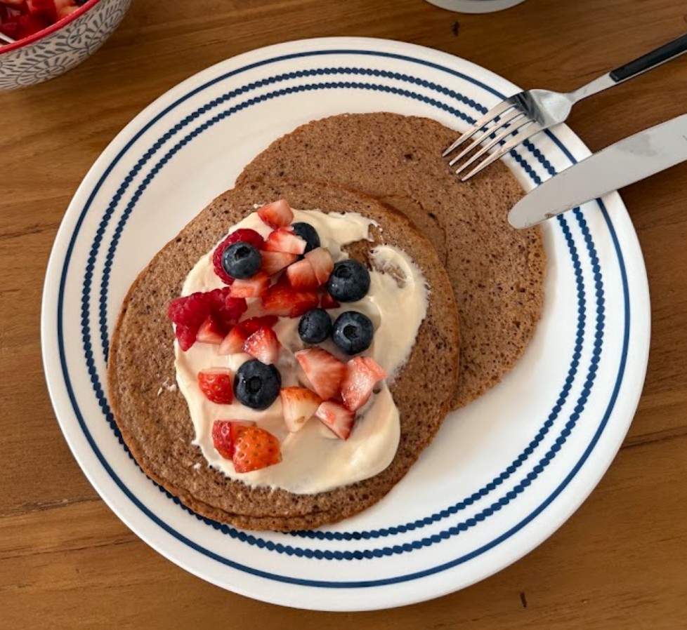 Protein pancakes topped with Greek yogurt and berries